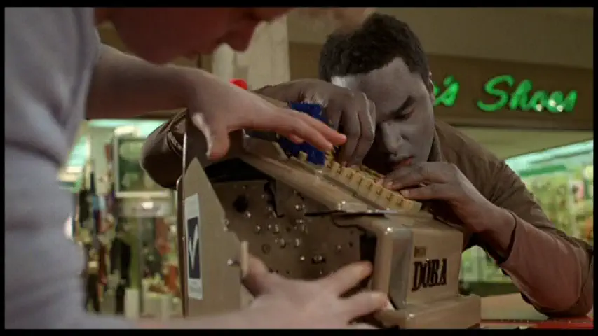 zombies pawing at a mall cash register
